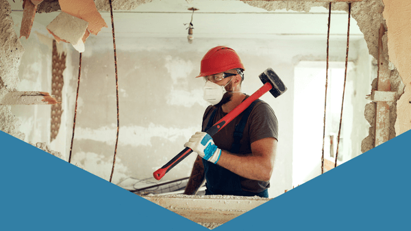 Hero image of construction worker taking out wall