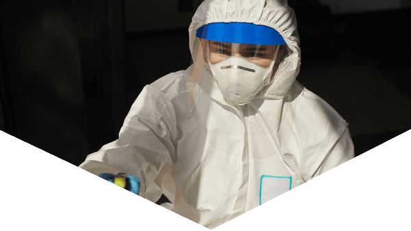 Hazmat worker cleaning with blue and black triangle design