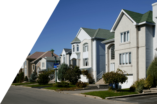 Photo of neighbourhood homes with blue sky in behind