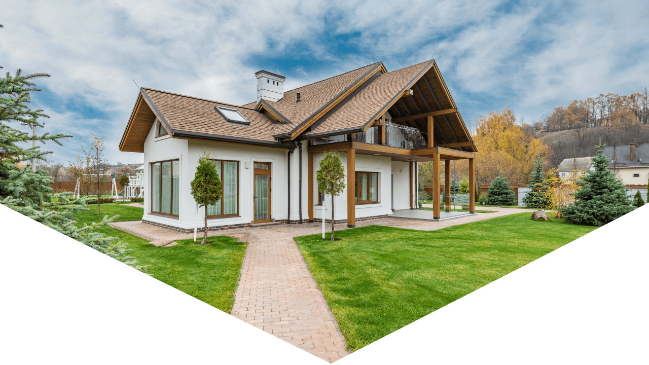 Exterior photo of home with greenery and blue skies outside home