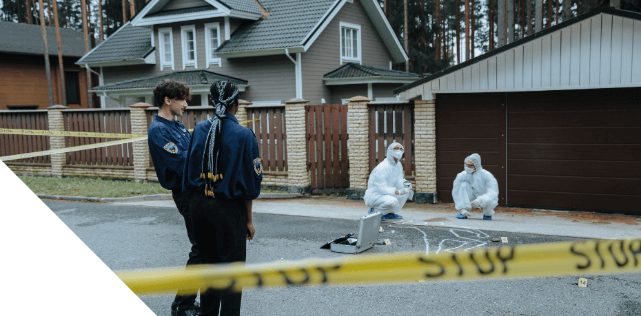 Photo of crime scene with police tape encompassing home and police surrounding it