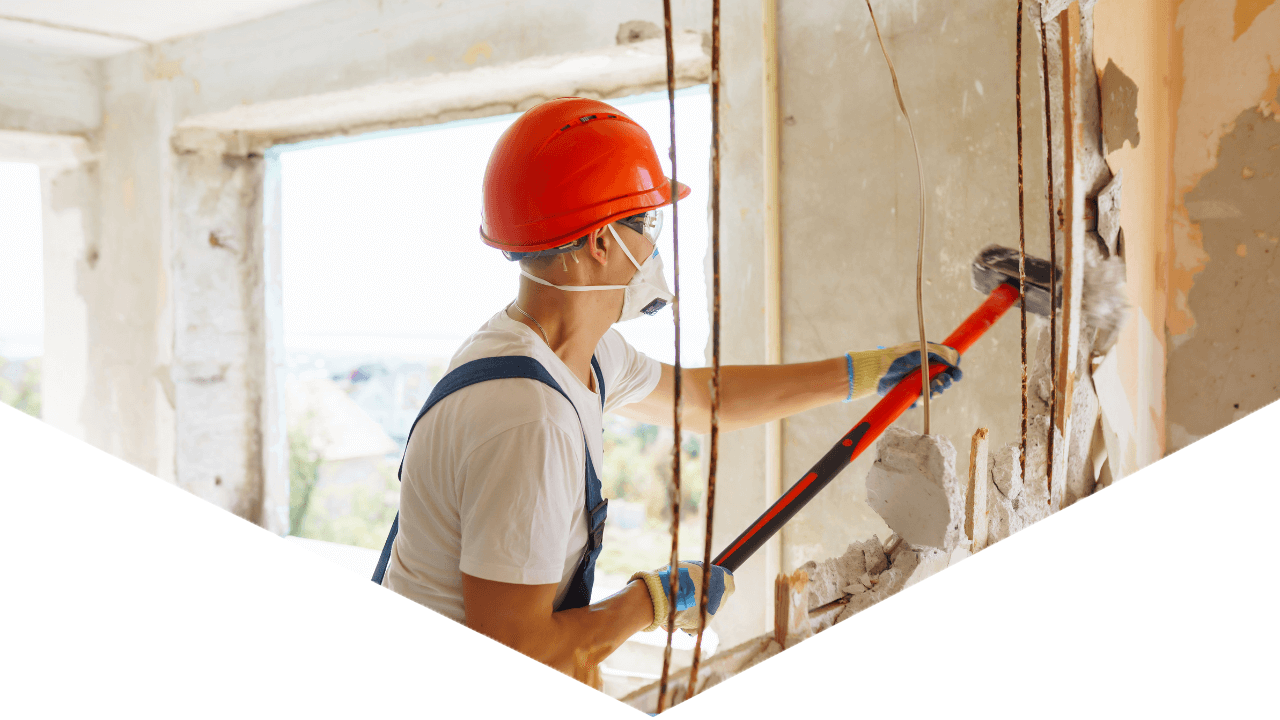 Harbour Hazmat provides general demolition services, construction worker deconstructing building