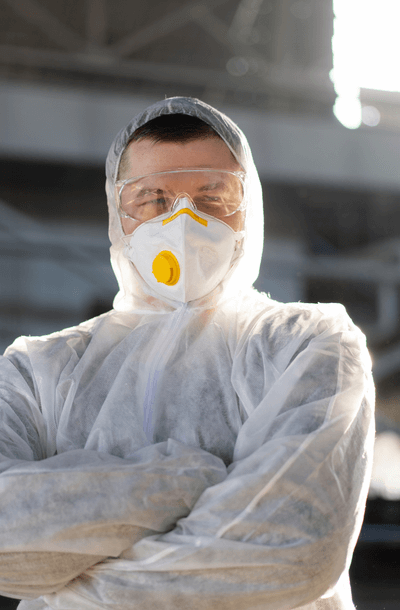 Photo of Harbour Hazmat worker looking a the camera with mask on