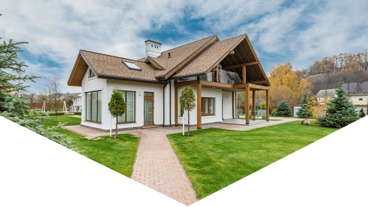Exterior photo of home with greenery and blue skies outside home