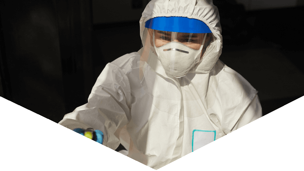 Hazmat worker cleaning with blue and black triangle design